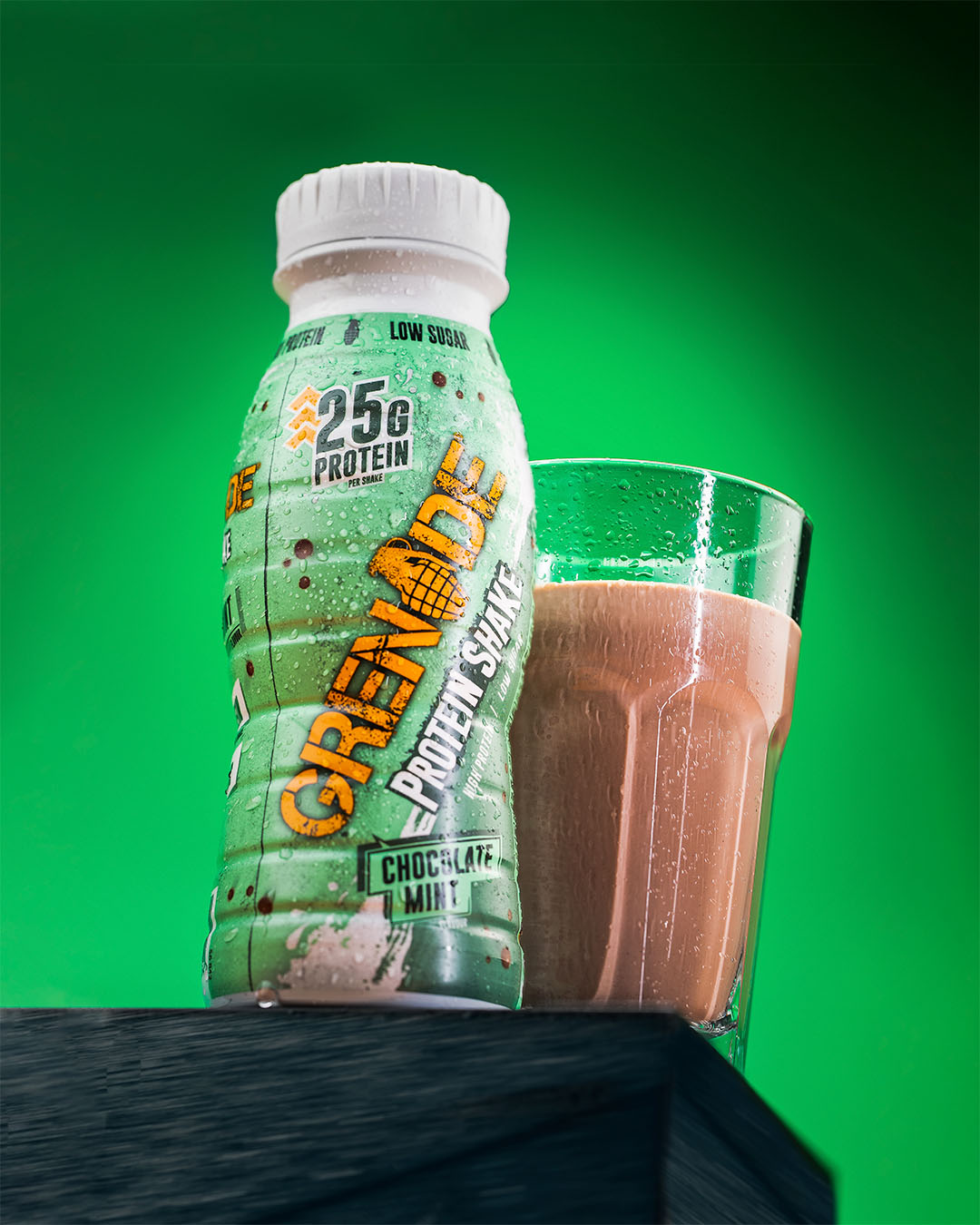 Grenade Mint Chocolate Protein Shake in a glass next to bottle