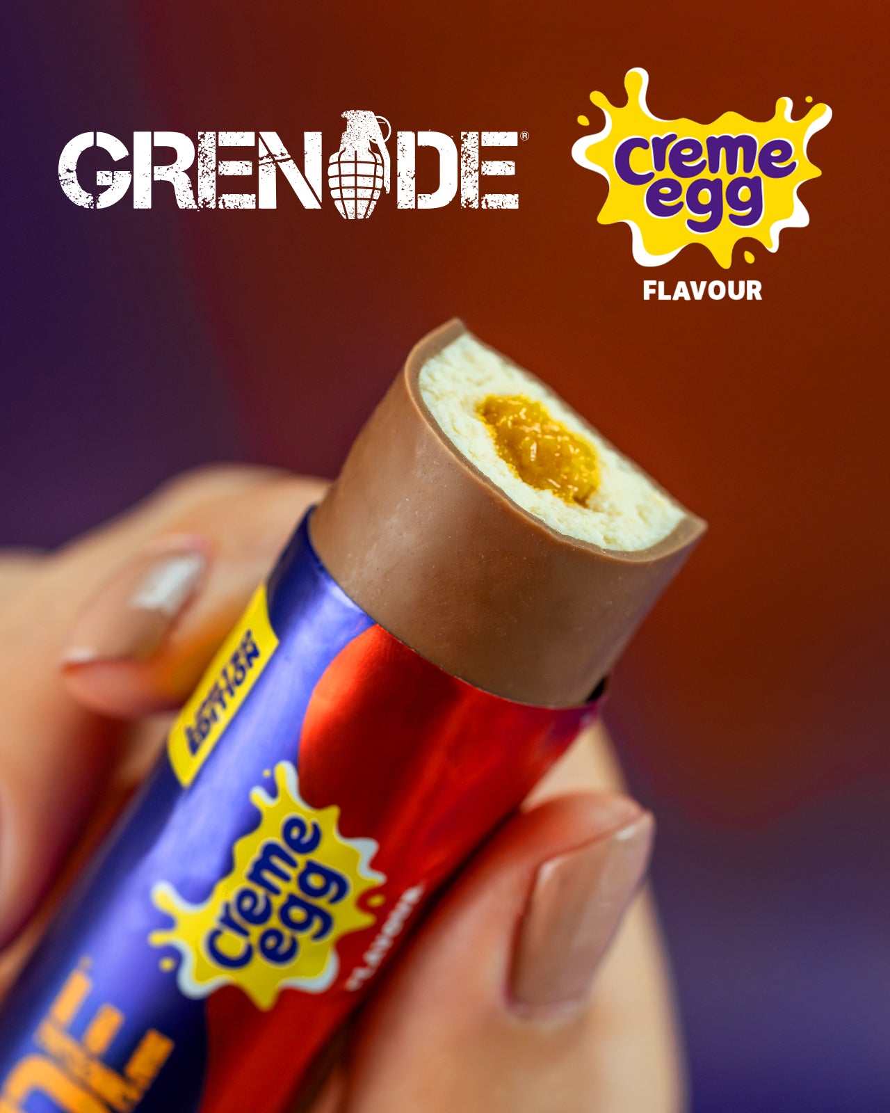 Creme Egg Grenade chocolate bar held by a hand with Grenade packaging.