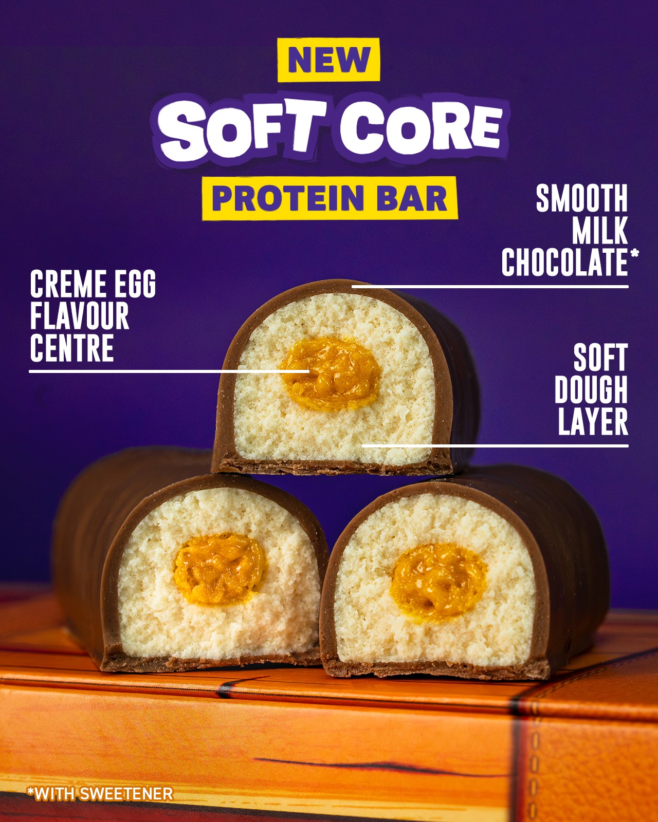 Protein bar with crème egg flavor on a wooden surface against a purple background